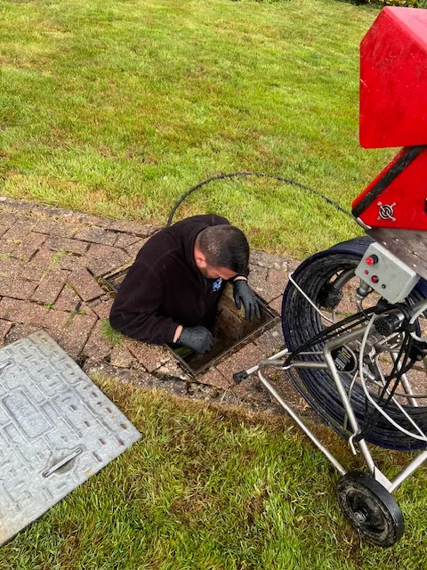 A man is working on a piece of equipment.